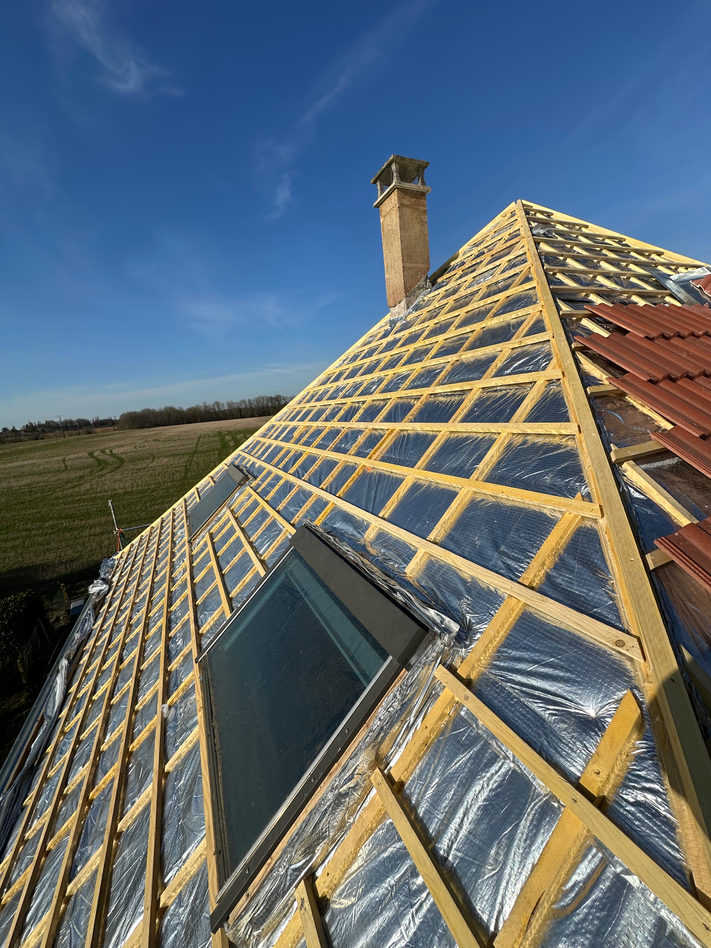Charpente avec Velux et écran sous-toiture